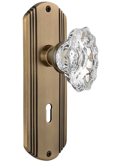 Streamline Deco Mortise-Lock Set with Chateau Crystal Glass Knobs in Antique Brass.